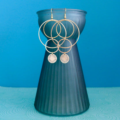 Boucles d'oreilles graphiques cascade de cercles dorés